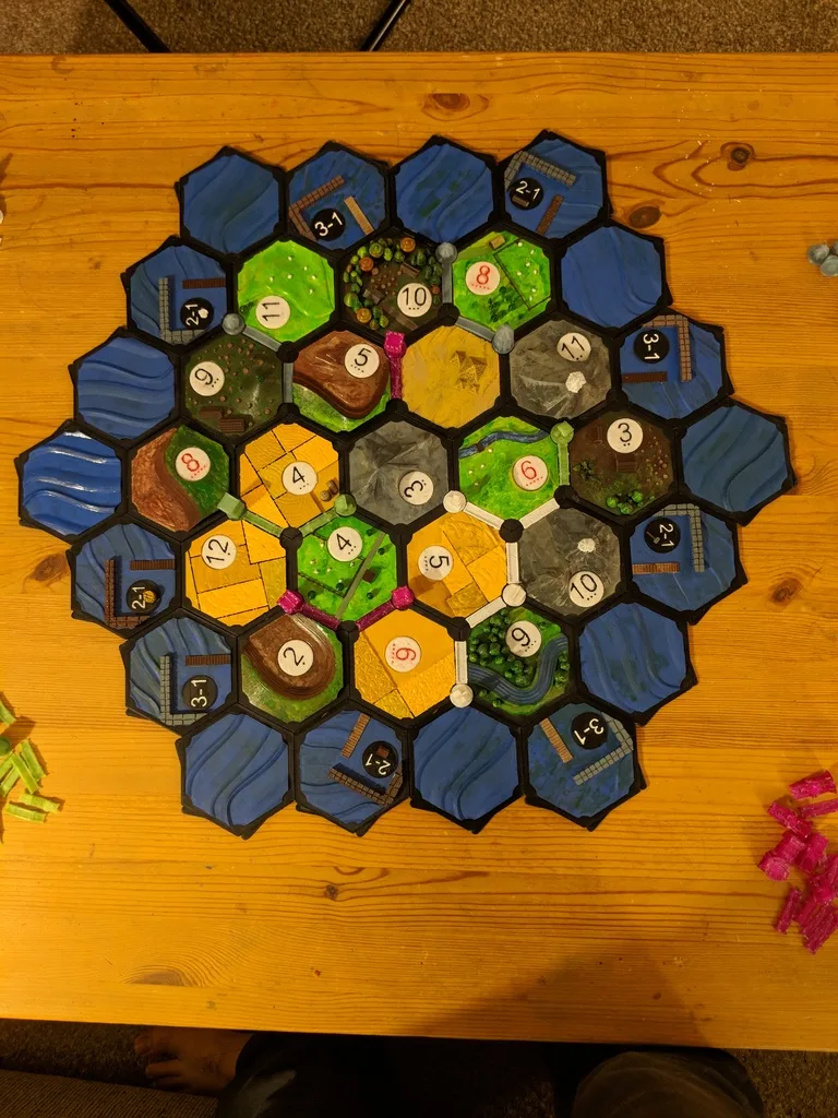 Settlers of Catan with player sets and storage