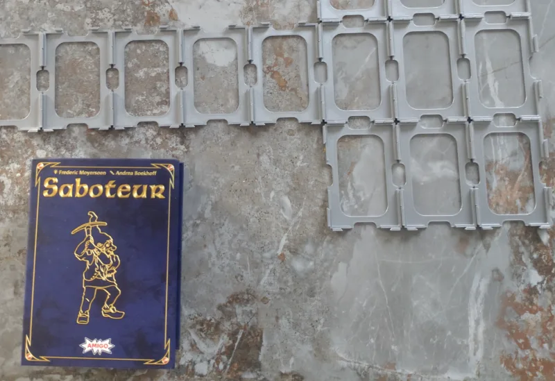 "Saboteur" card holder/playing field
