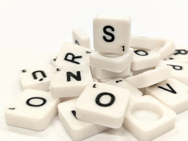 Scrabble letter tiles/rocks/stones
