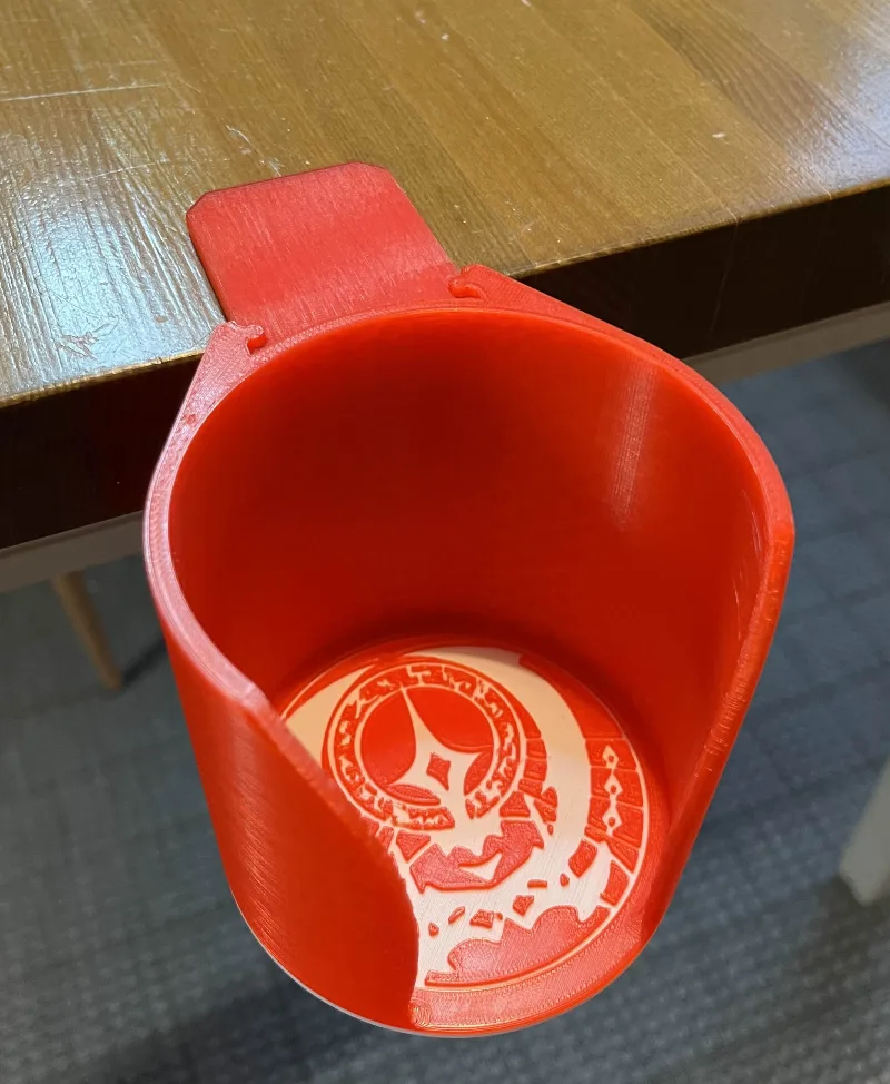 The Laptop Saver drink holder with Agemonia hero logos