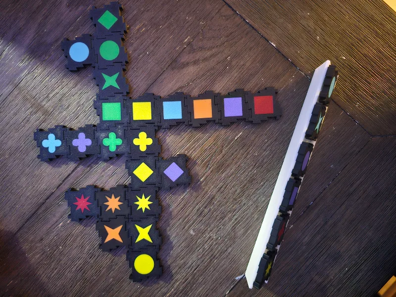 Qwirkle Set with Interconnected Pieces