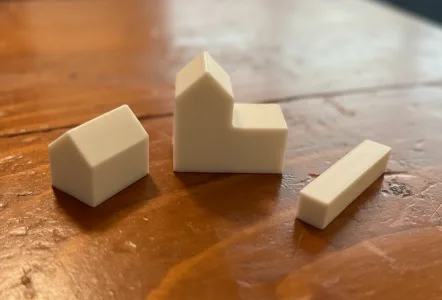 Extra Catan pieces- city, road, and settlement