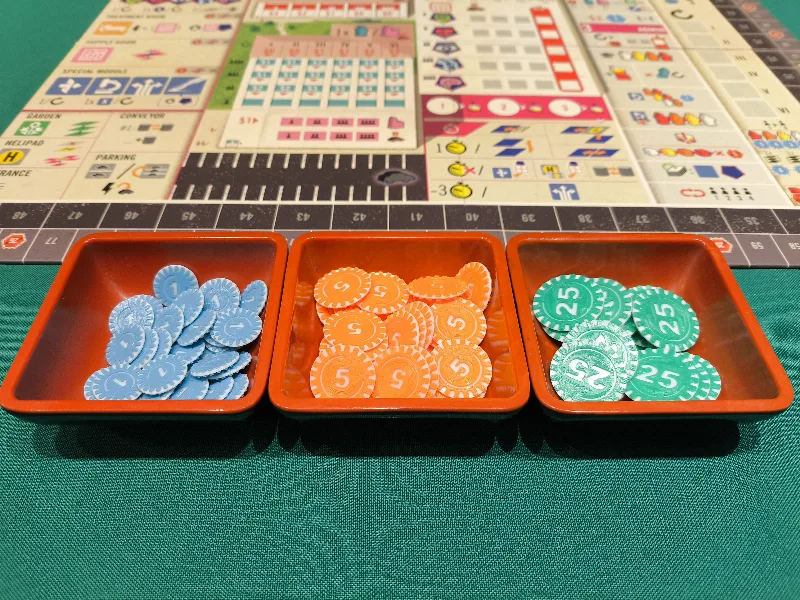 Clinic Deluxe boardgame coins