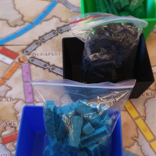Containers for "Ticket to ride" board game trains
